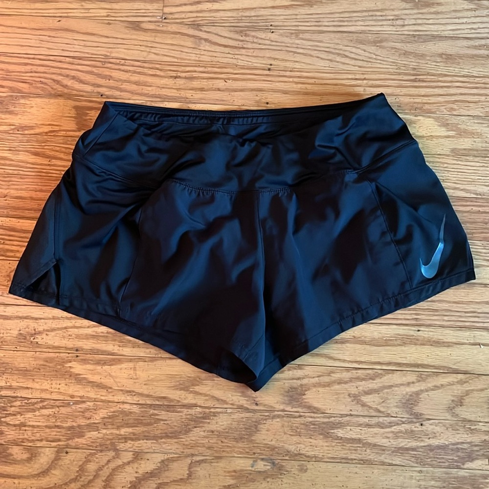 Nike running shorts size M.